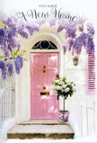 A charming Pimlico entranceway is dressed as if for a personal celebration, blending architecture and flowers into one soft, welcoming tableau. The front door is painted in a delicate pink, its colour somewhere between rose and blush, and the simple raised panels catch the subdued city light. Around it, whitewashed walls provide a calm background, with faint brushstrokes and subtle imperfections that hint at the building's age and character. Overhead, wisteria trails in abundant strands of lavender and lilac, the pendulous blooms forming airy curtains that frame the top of the doorway, much like the drifts of blossom that appear in spring around Eccleston Square. A single shutter, also touched with a muted pink wash, extends the palette upward, helping your mind picture the way light shifts across the façade throughout the day. On the doorstep, a metal bucket in soft grey serves as an informal yet elegant vase, overflowing with creamy white roses. The roses are arranged in a lush, rounded shape, their velvety petals spiralling tightly at the centre and opening gently at the edges. Threads of soft green foliage add movement and a natural accent, keeping the arrangement fresh and not overly formal. A pale pink ribbon is tied around the bucket, its bow relaxed and slightly asymmetric, giving a lovely lived-in feel. The whole scene feels like a quiet housewarming gift waiting outside a new Pimlico home: hopeful, affectionate, and full of the promise that this door will be crossed by friends, neighbours, and family for years to come.